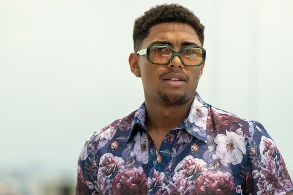 man with glasses and floral shirt