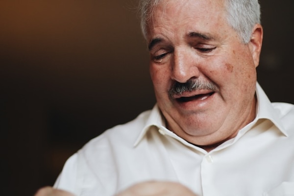 man holding a baby and crying