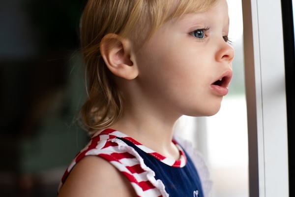 child looking out the window