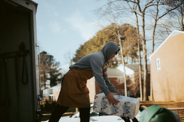 man loading a gift package