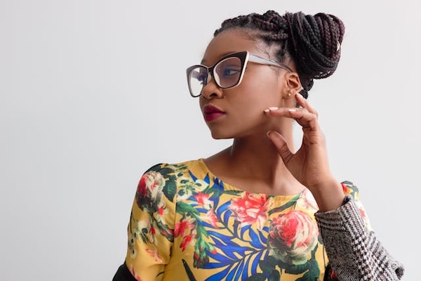 young girl wearing glasses and a colorful top