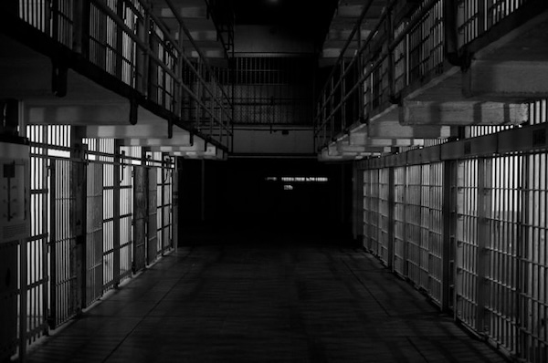 empty prison cells in black and white