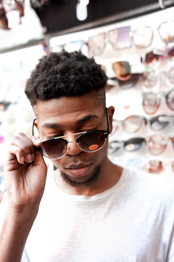 man tries on a pair of glasses